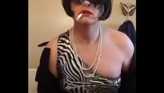 Nikki Seduces in Silver Dress and Heels While Smoking Sensually