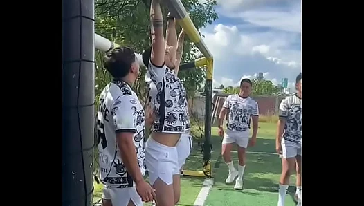 A soccer team, with the help of the sun, and sweat, ends up nailing each other