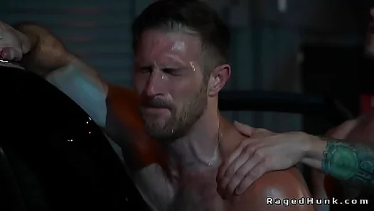 Gay driver anal fucks client in a trunk in an abandoned garage