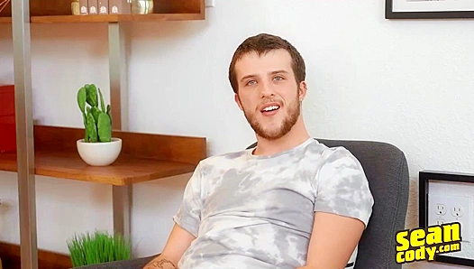 Tattooed Stud Masturbates Intensely on Luxurious Couch